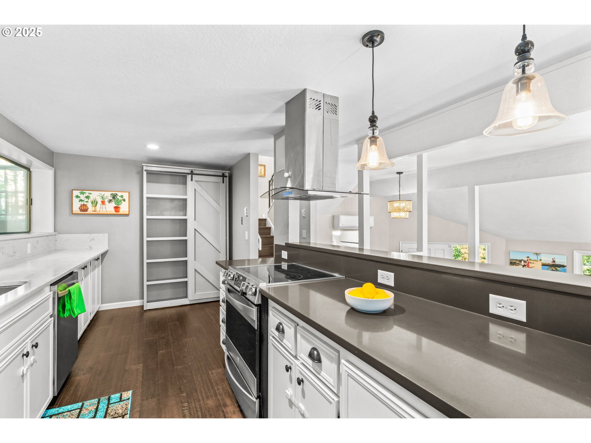 792 Brookside Drive Eugene, OR 97405 - Photo 20 of 46 a kitchen with stainless steel appliances granite countertop a sink a stove and a wooden floors