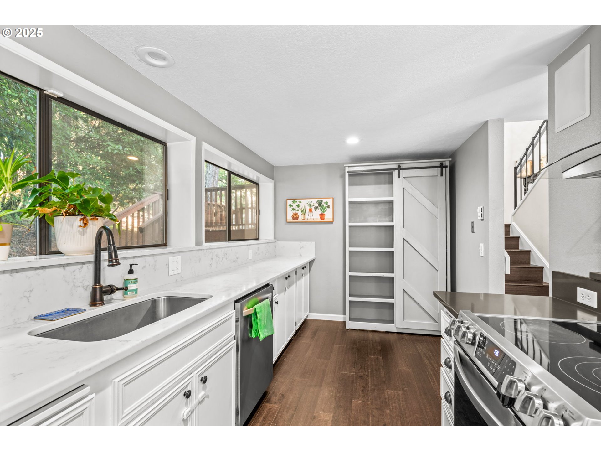 792 Brookside Drive Eugene, OR 97405 - Photo 21 of 46 a kitchen with a sink stove and cabinets