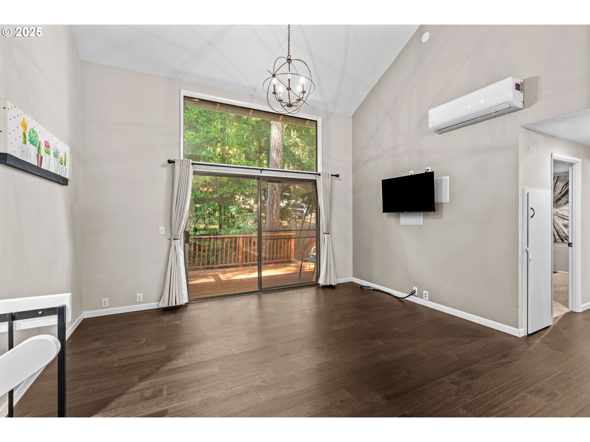 792 Brookside Drive Eugene, OR 97405 - Photo 26 of 46 a view of an empty room with wooden floor and a window