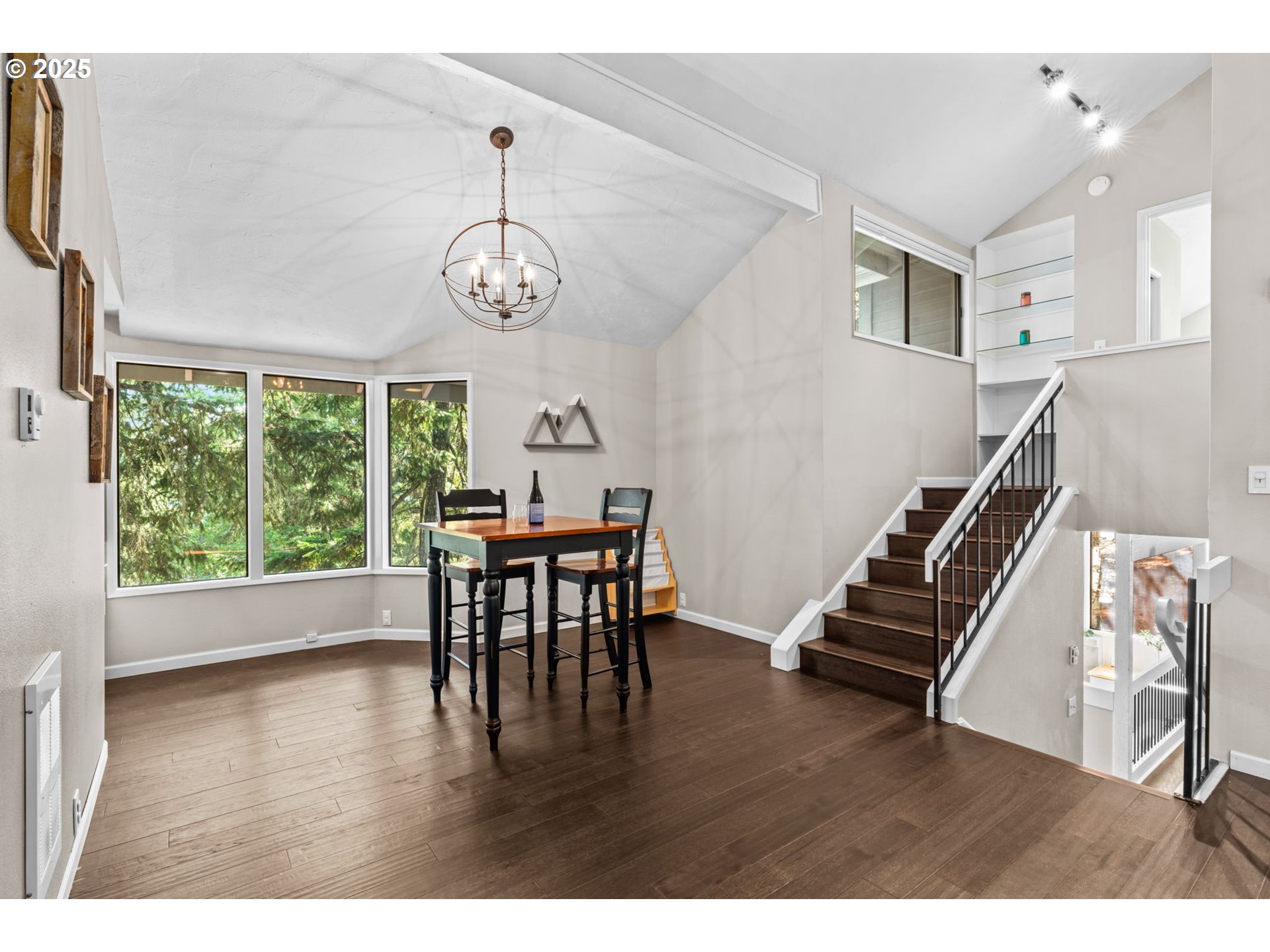 792 Brookside Drive Eugene, OR 97405 - Photo 36 of 46 a view of a dining room with furniture wooden floor and a chandelier