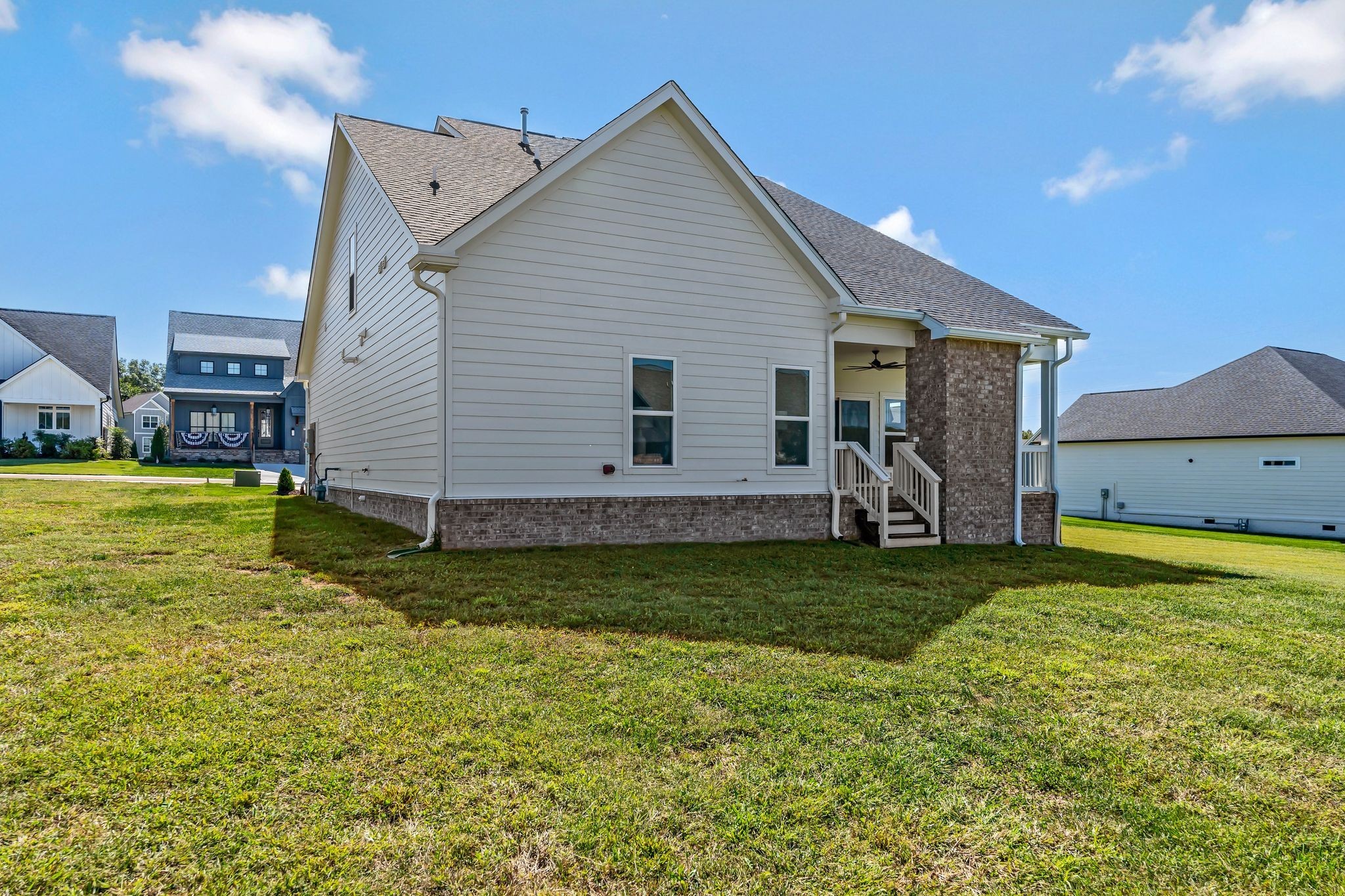 50 Pontoon Place Winchester, TN 37398 - Photo 43 of 57 a backyard of a house with wooden fence and a lawn chairs