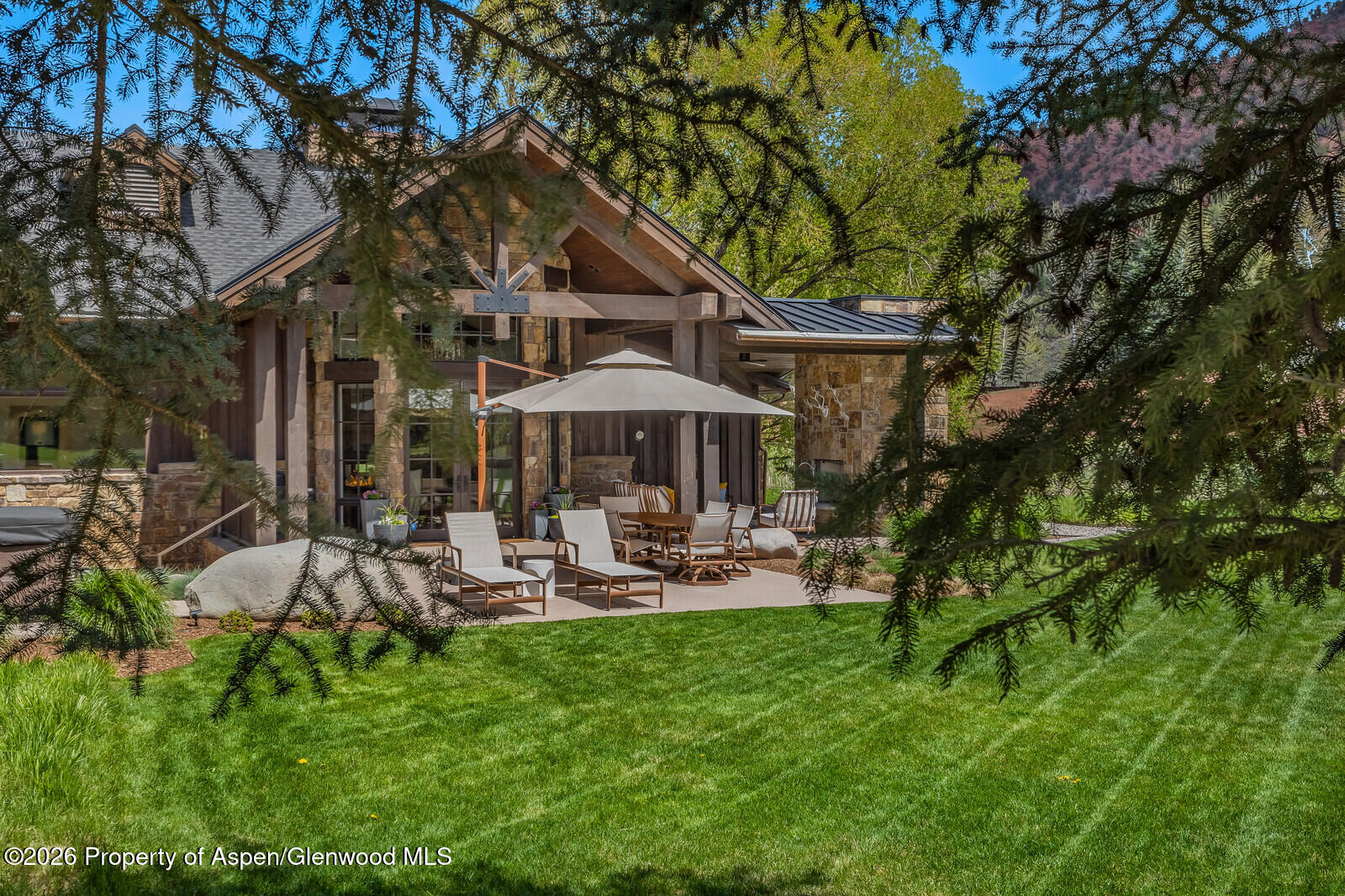 38 Diamond A Ranch Road Carbondale, CO 81623 - Photo 118 of 158 Backyard, Patio with Fireplace, Dining