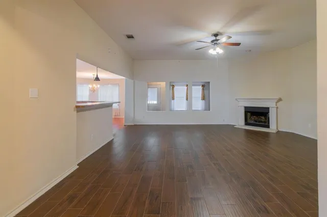 workspace with kitchen island granite countertop stainless steel appliances and cabinets