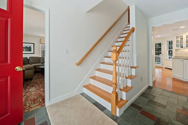 a bathroom with a sink a toilet a shower and a mirror