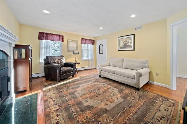a view of a dining room with furniture wooden floor and chandelier