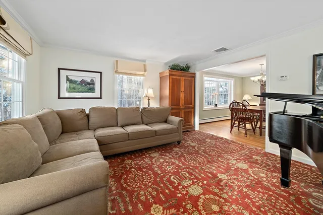 a bedroom with furniture and a flat screen tv