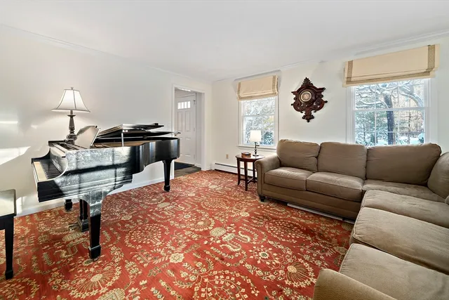 a spacious bedroom with a bed a table and a window