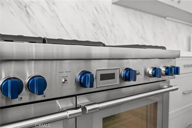 a view of a hallway with furniture and wooden floor