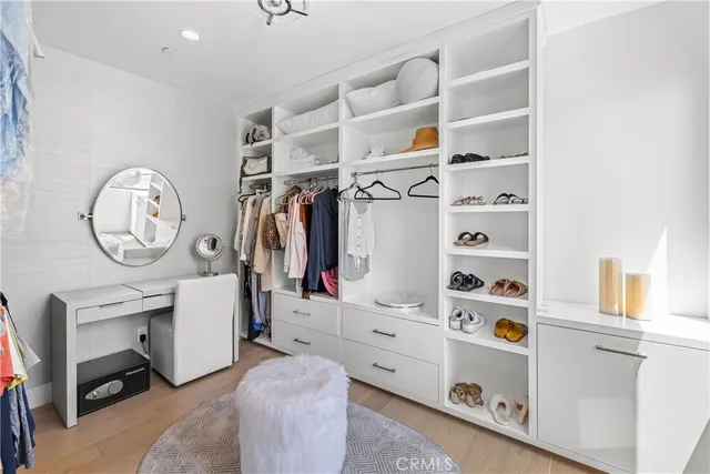 a bathroom with a double vanity sink mirror and bathtub