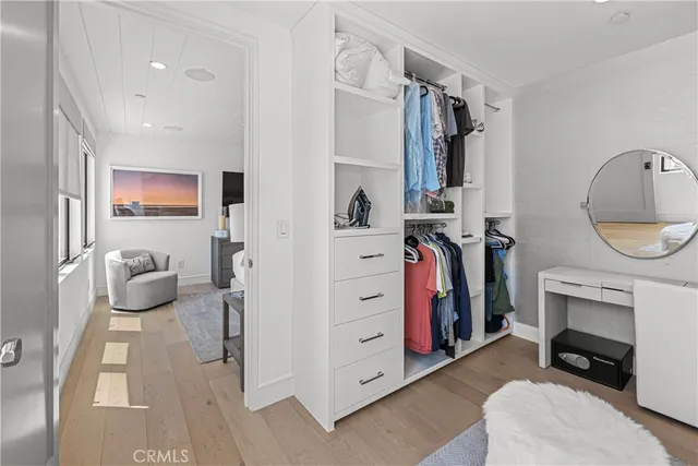 a room with a refrigerator and cabinets