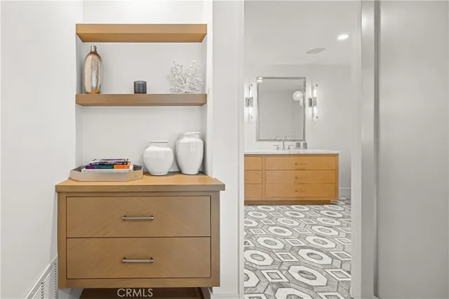 a bathroom with a double vanity sink mirror and double