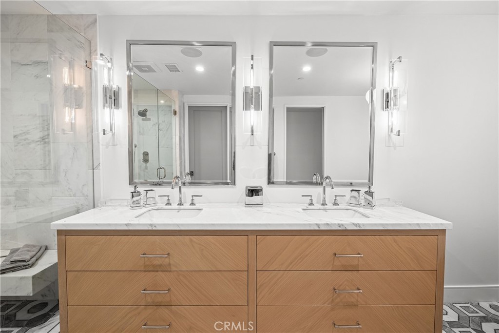 2200 The Strand, Unit B Manhattan Beach, CA 90266 - Photo 32 of 35 a bathroom with a double vanity sink mirror and double