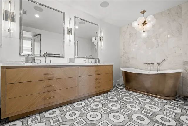 a white bath tub sitting next to a white sink
