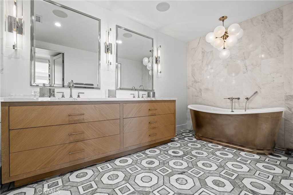 2200 The Strand, Unit B Manhattan Beach, CA 90266 - Photo 33 of 35 a bathroom with a sink and a mirror