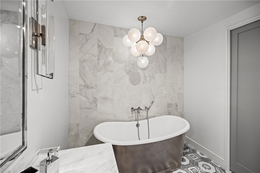 2200 The Strand, Unit B Manhattan Beach, CA 90266 - Photo 35 of 35 a white bath tub sitting next to a white sink