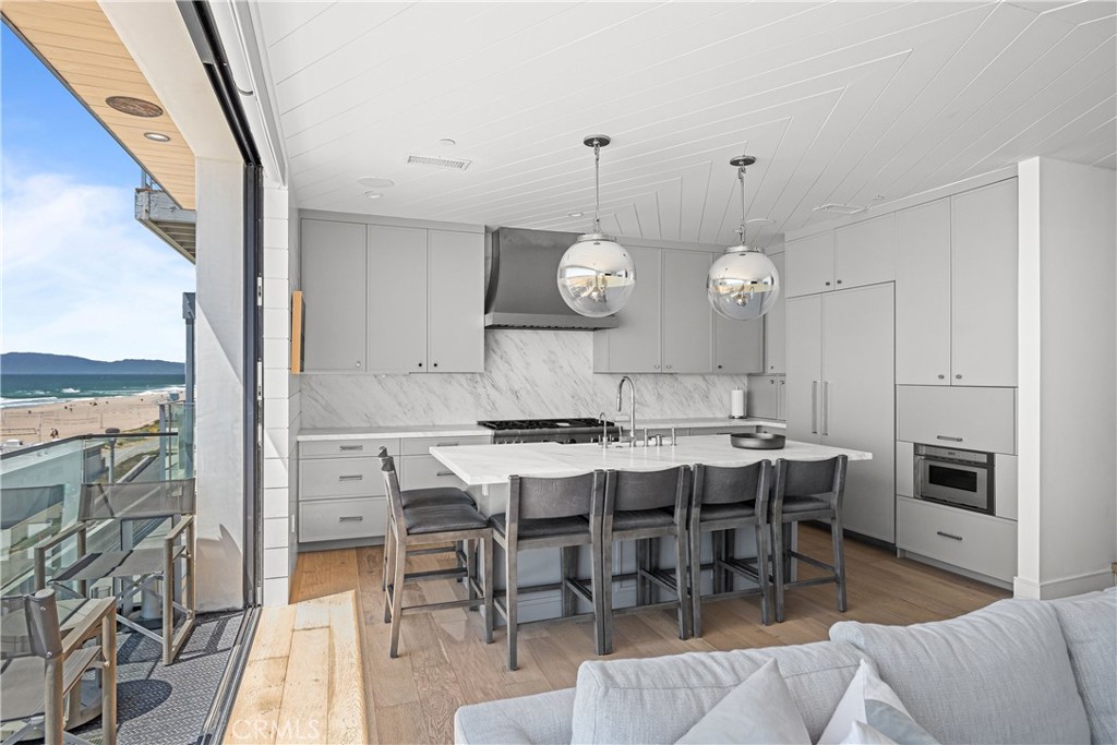 2200 The Strand, Unit B Manhattan Beach, CA 90266 - Photo 9 of 35 a large kitchen with a table and chairs