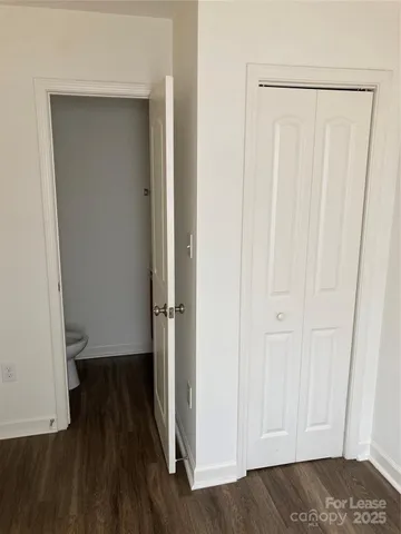 a kitchen with a sink a refrigerator and wooden cabinets
