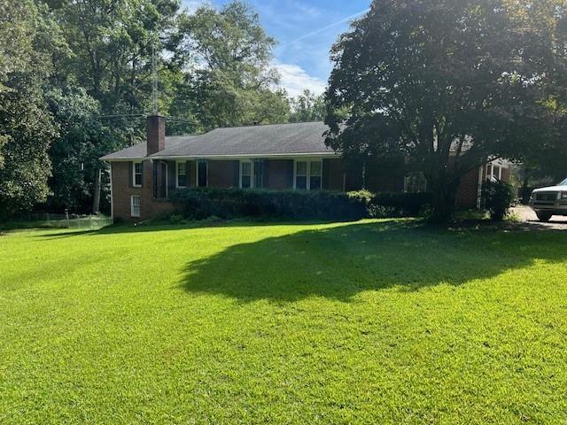 3415 Lake Carlton Road Loganville, GA 30052 - Photo 3 of 6 a view of a house with a yard porch and sitting area