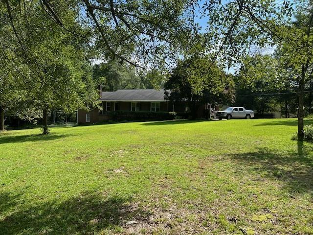 3415 Lake Carlton Road Loganville, GA 30052 - Photo 6 of 6 a view of a house with a yard