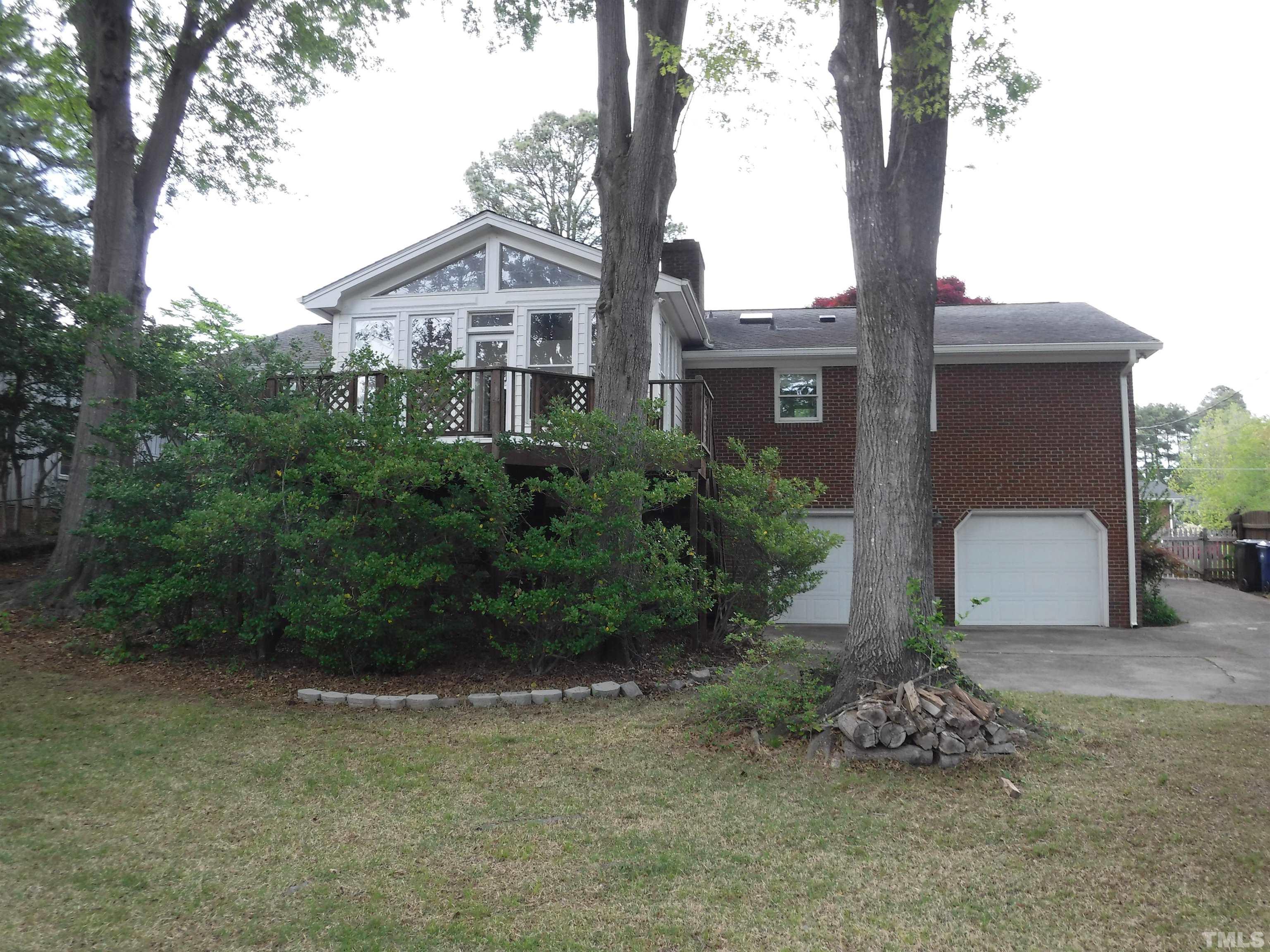 1008 Deerfield Road Raleigh, NC 27609 - Photo 4 of 18 a view of a house with a backyard
