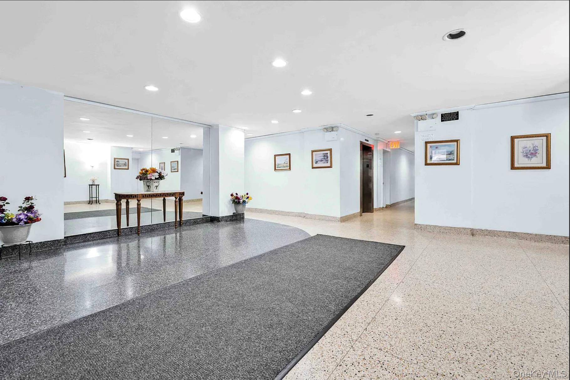 30-44 29th Street, Unit 6D Queens, NY 11102 - Photo 12 of 15 a view of a living room and kitchen with furniture