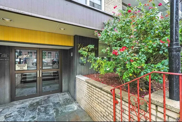 a view of a backyard with flowers
