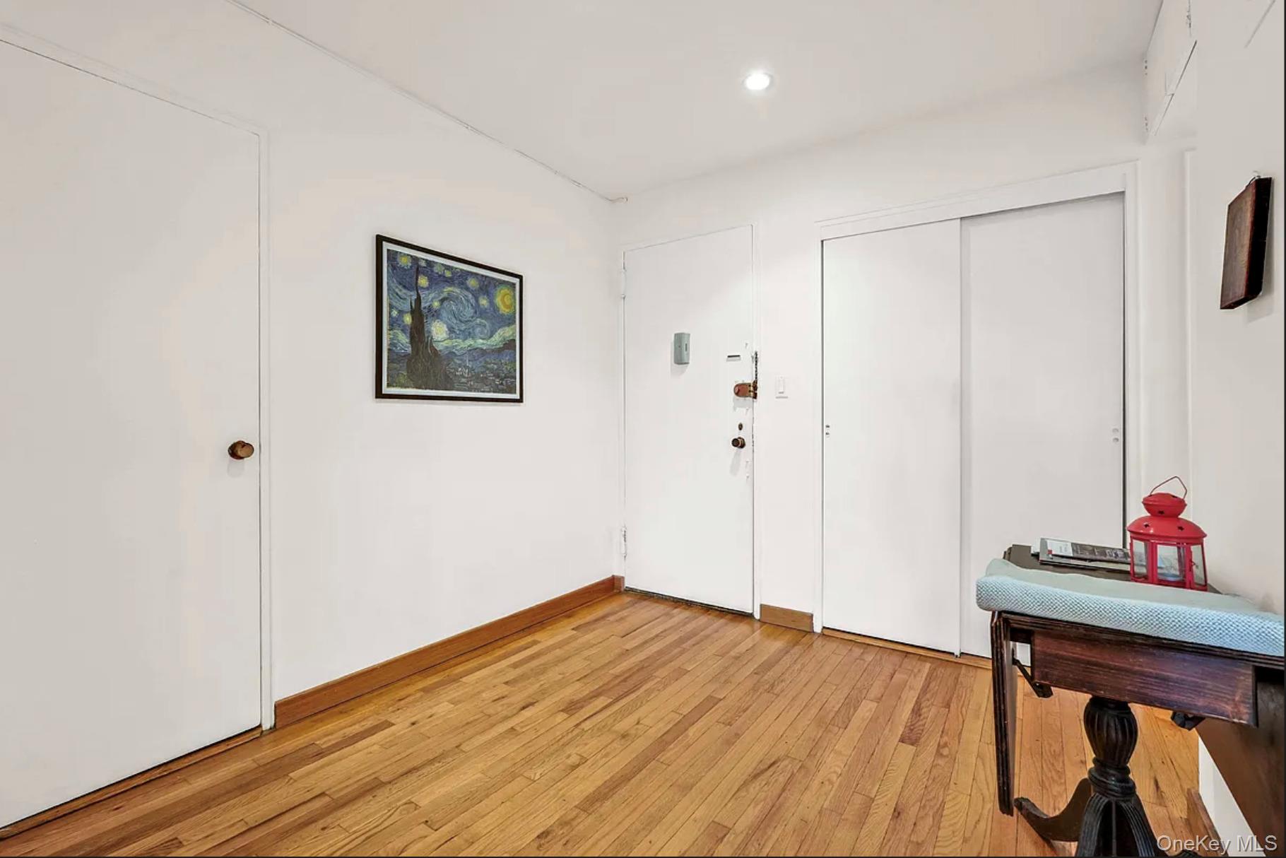 30-44 29th Street, Unit 6D Queens, NY 11102 - Photo 8 of 15 a view of an empty room and wooden floor