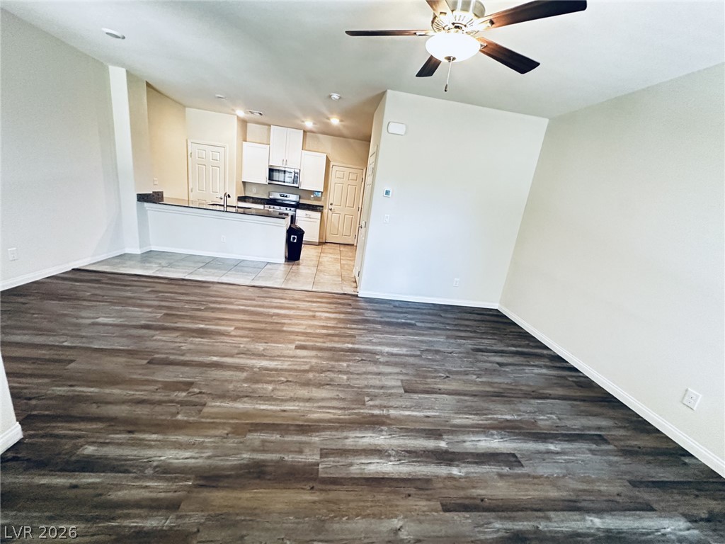 The open-concept layout seamlessly connects the living area with the kitchen, creating an inviting atmosphere.