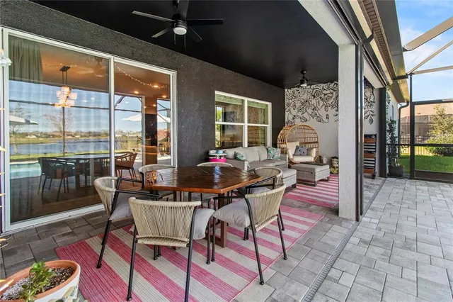 a view of a kitchen with fridge and wooden floor