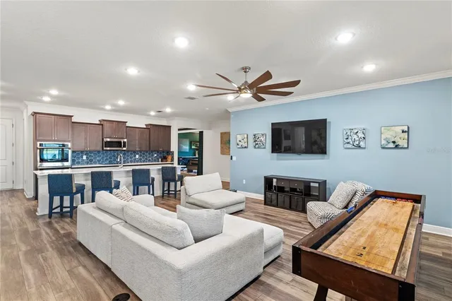 a living room with furniture and a chair