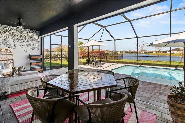 a large kitchen with a table and chairs