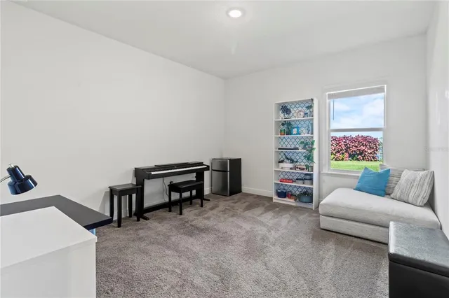 a view of a lake with a house in the background