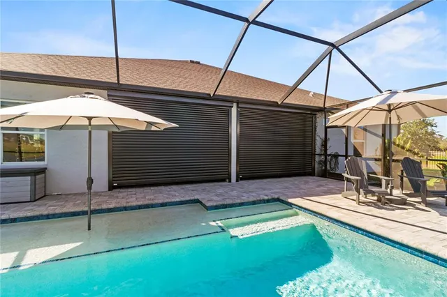 a kitchen with stainless steel appliances granite countertop a sink stove and microwave