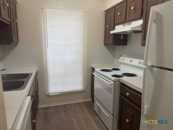 a kitchen with a stove and a microwave