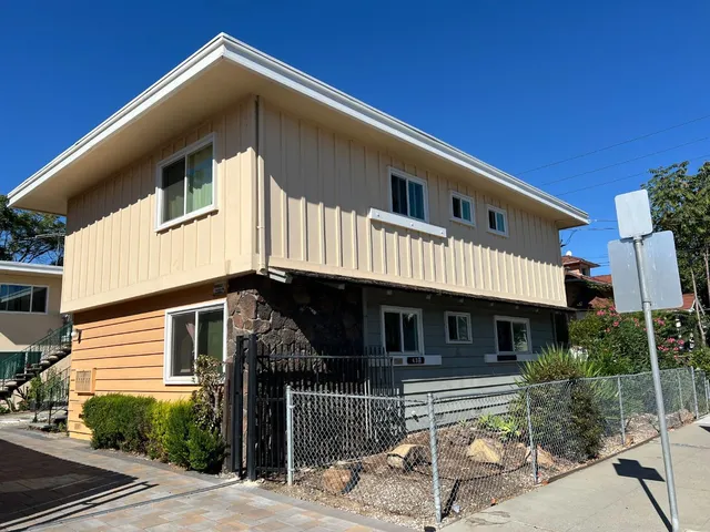 a front view of a house with garage