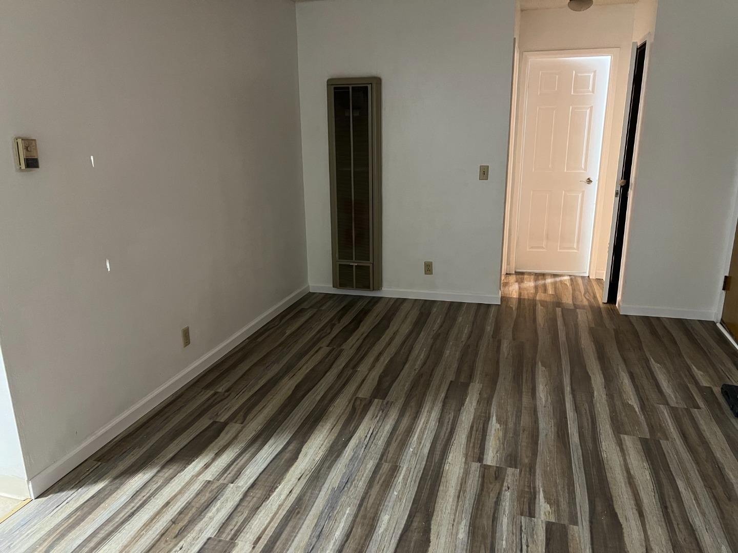 431 East St John Street San Jose, CA 95112 - Photo 21 of 32 a view of a room with wooden floor and bench