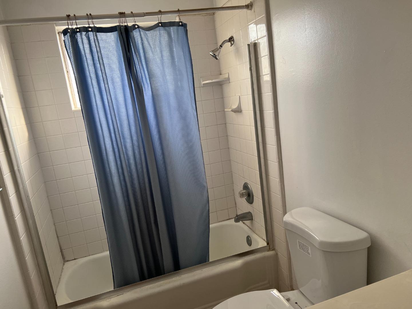 431 East St John Street San Jose, CA 95112 - Photo 27 of 32 a bathroom with a shower and a toilet