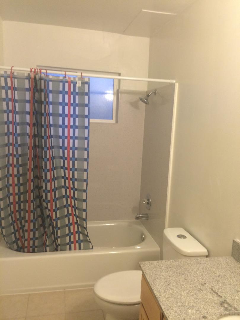 431 East St John Street San Jose, CA 95112 - Photo 29 of 32 a bathroom with a granite countertop bathtub shower sink vanity and toilet