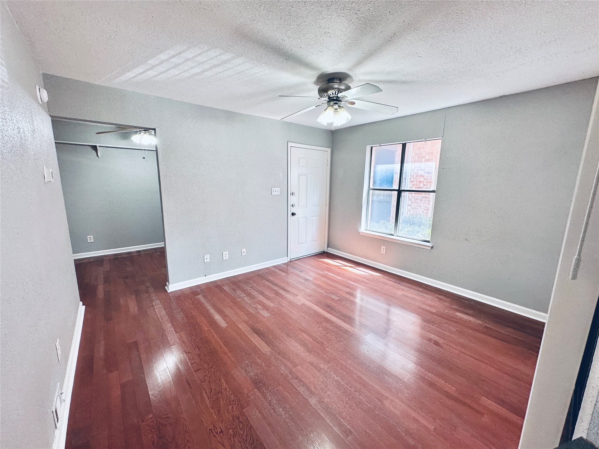 Rich hardwood floors flow through this welcoming living space.
