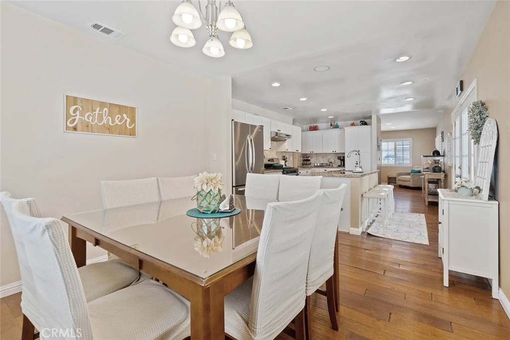 14022 Arlee Place Sylmar, CA 91342 - Photo 14 of 33 a view of a dining room with furniture and wooden floor