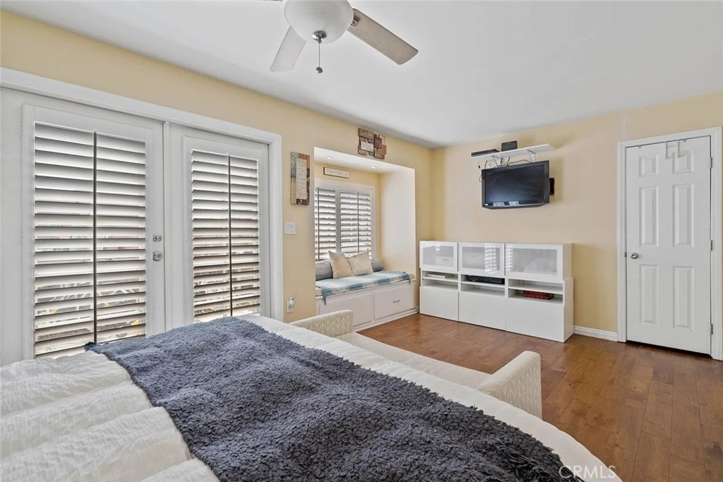 14022 Arlee Place Sylmar, CA 91342 - Photo 17 of 33 a spacious bedroom with a bed a dresser and a large window