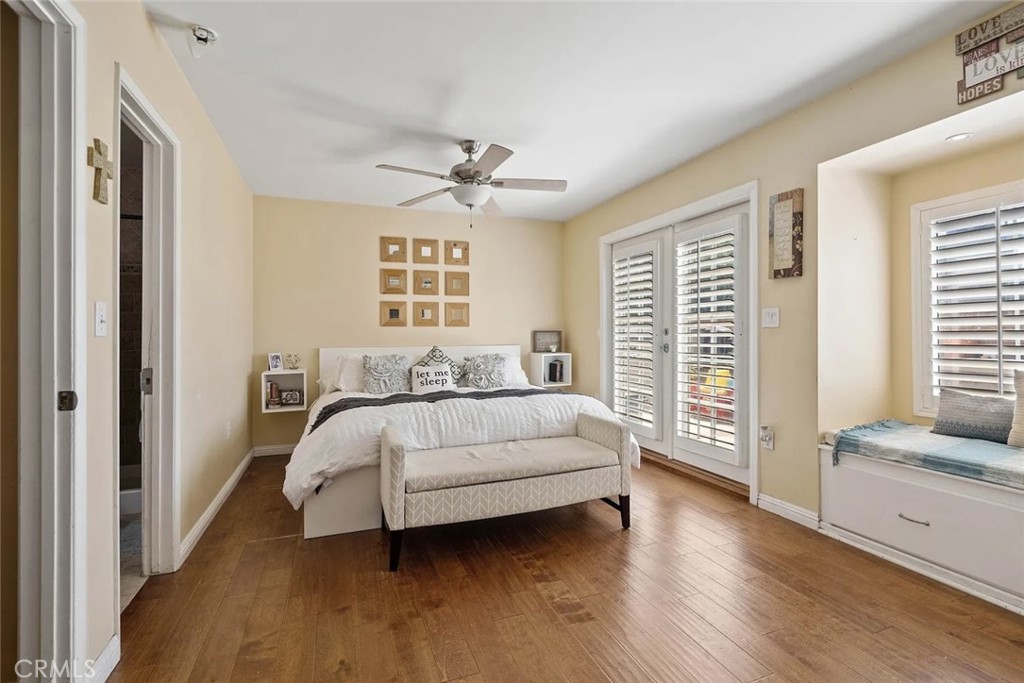 14022 Arlee Place Sylmar, CA 91342 - Photo 19 of 33 a spacious bedroom with a bed and a large window