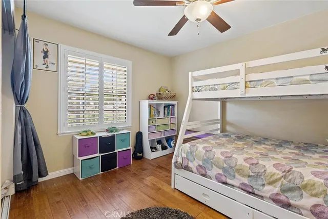 a bedroom with a bed and a bookshelf