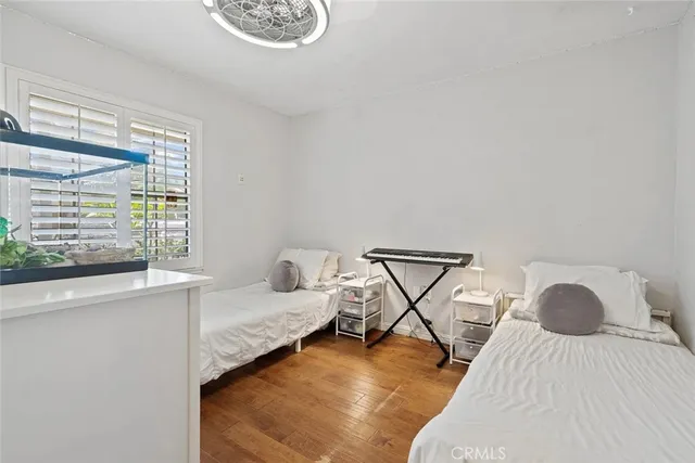 a bedroom with a bed and window