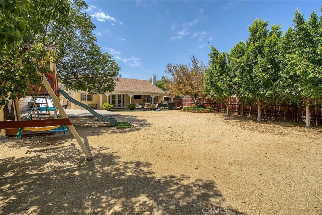 14022 Arlee Place Sylmar, CA 91342 - Photo 28 of 33 a view of swimming pool with lawn chairs and plants