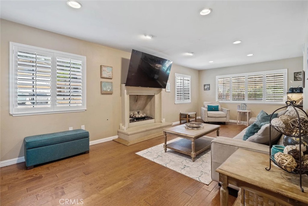 14022 Arlee Place Sylmar, CA 91342 - Photo 7 of 33 a living room with furniture and a flat screen tv