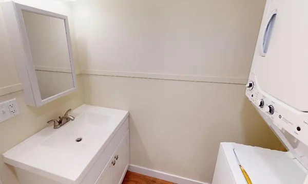a bathroom with a sink and mirror