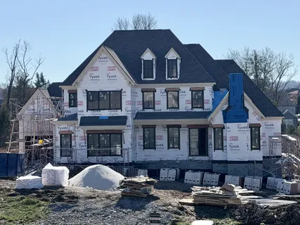 a sign that is in front of flowers