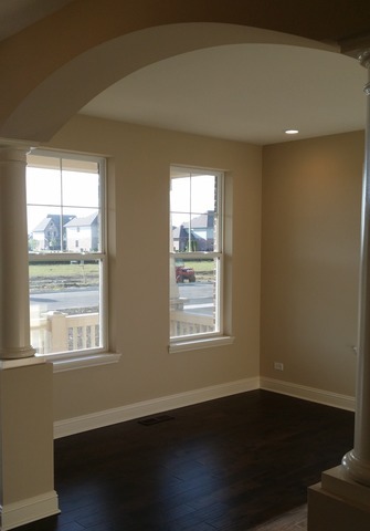 2056 Stapleton Road New Lenox, IL 60451 - Photo 10 of 25 a view of an empty room with wooden floor and a window