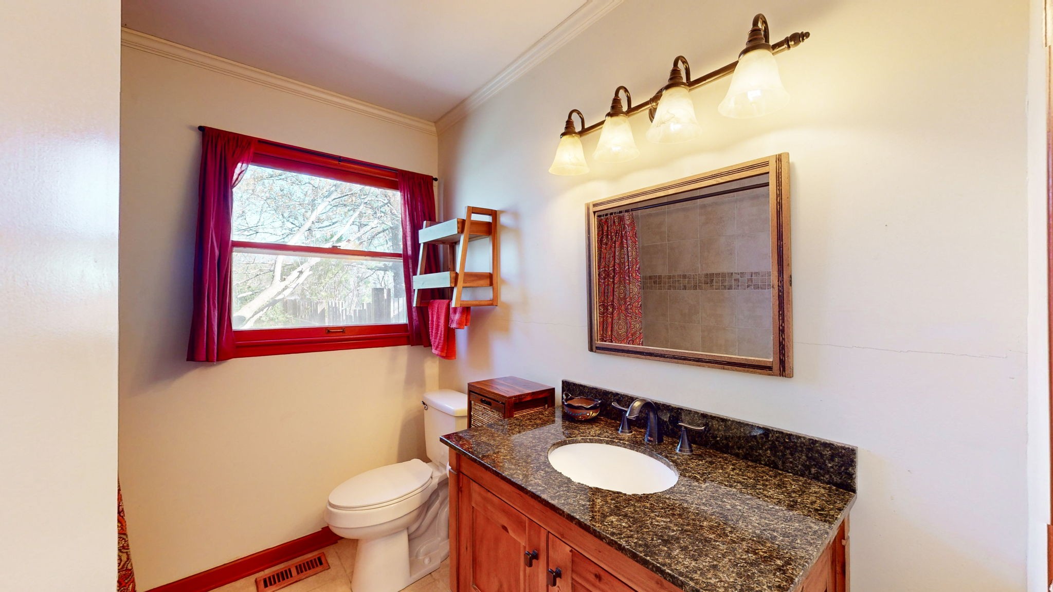 1510 Avon Road Murfreesboro, TN 37129 - Photo 18 of 35 a bathroom with a granite countertop toilet a sink and a mirror